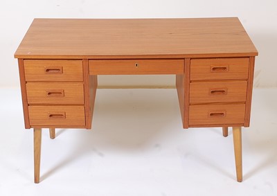 Lot 367 - A 1960s Danish laminate veneered kneehole desk,...