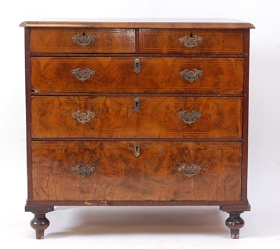 Lot 1432 - An early 18th century walnut chest, the four...