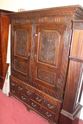 Lot 1461 - An 18th century joined oak livery cupboard,...