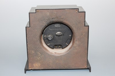 Lot 165 - An Art Deco bakelite mantel clock, the case of...