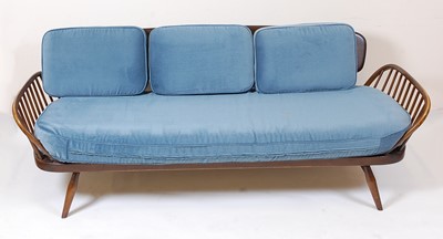 Lot 375 - A 1960s Ercol dark elm three-seater 'Surfboard'...