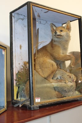 Lot 18 - A Victorian taxidermy model of a fox with prey,...