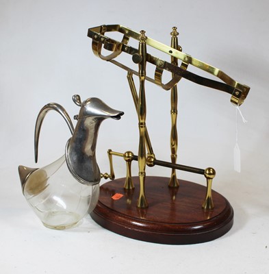 Lot 21 - A brass framed decanting cradle with rotating...
