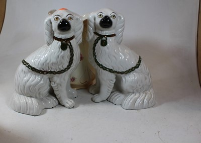 Lot 26 - A pair of Staffordshire seated spaniels, on a...