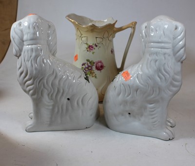 Lot 26 - A pair of Staffordshire seated spaniels, on a...
