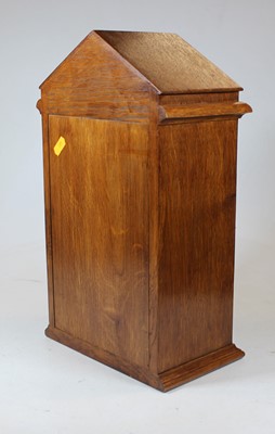 Lot 27 - A 20th century oak letter-box in the form of a...