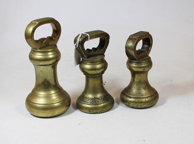 Lot 43 - A set of three early 20th century brass bell...