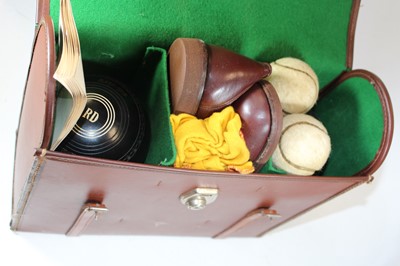 Lot 76 - A set of "Imp" brand lawn bowls in leather...