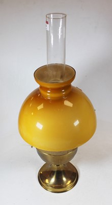 Lot 83 - An early 20th century brass pedestal oil lamp,...