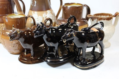 Lot 90 - A 19th century Staffordshire brown glazed cow...