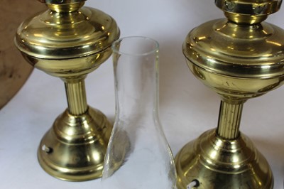 Lot 101 - An early 20th century brass pedestal oil lamp,...