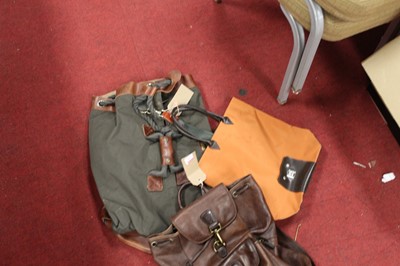 Lot 142 - A canvas and leather clad Timberland bag;...