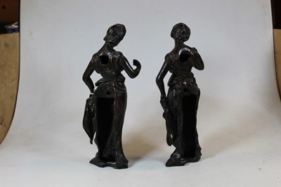 Lot 166 - A pair of bronze figures, each modelled as a...