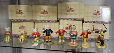 Lot 173 - A collection of eight Royal Doulton Rupert the...