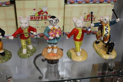 Lot 173 - A collection of eight Royal Doulton Rupert the...