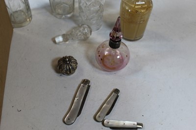Lot 174 - A pink tinted glass scent bottle and stopper,...