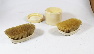 Lot 178 - A pair of Victorian ivory backed hand brushes,...