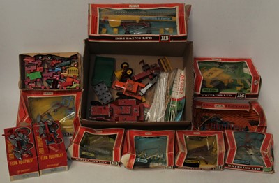 Lot 703 - Britains farm items and two Crescent ploughs,...