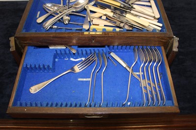 Lot 211 - An Edwardian oak cutlery canteen, the hinged...