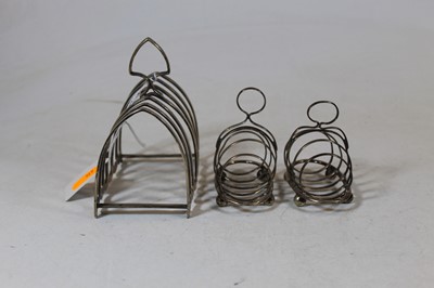 Lot 196 - A George V silver toast rack having six arched...