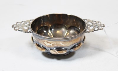 Lot 228 - A George V silver porringer having shaped bowl...