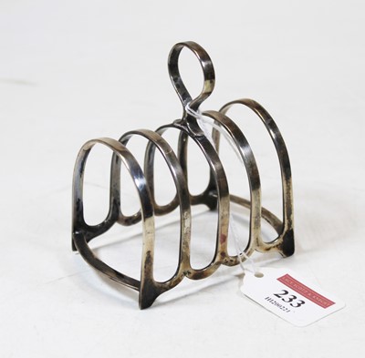 Lot 233 - A George V silver four division toast rack