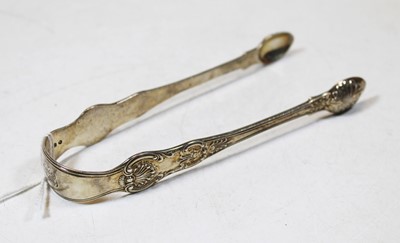 Lot 241 - A pair of 19th century silver sugar tongs, in...