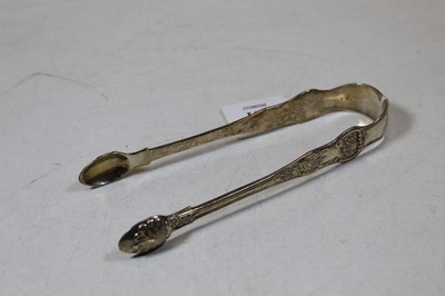 Lot 241 - A pair of 19th century silver sugar tongs, in...