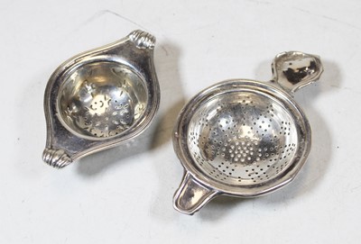 Lot 245 - An early 20th century silver tea strainer;...