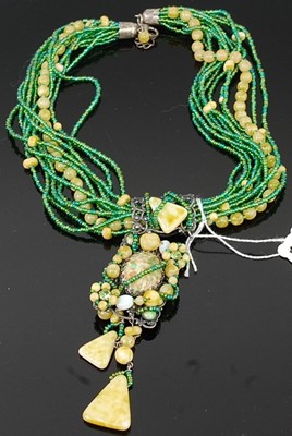 Lot 278 - A beaded multi-strand green and yellow glass...