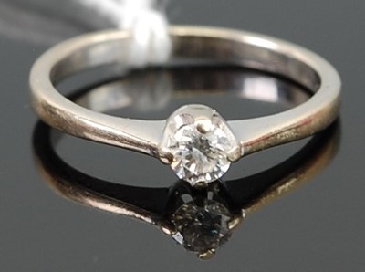Lot 279 - A 9ct white gold diamond solitaire ring, the...