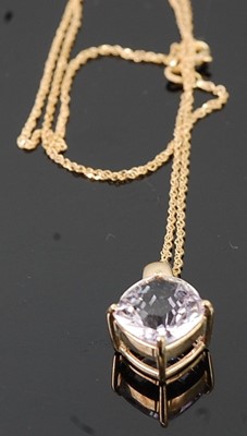 Lot 281 - A 9ct gold and amethyst set pendant, on...