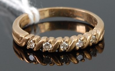 Lot 295 - A 9ct gold diamond set half eternity ring,...
