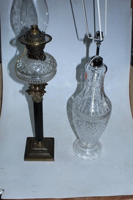 Lot 350 - An early 20th century oil lamp, having clear...