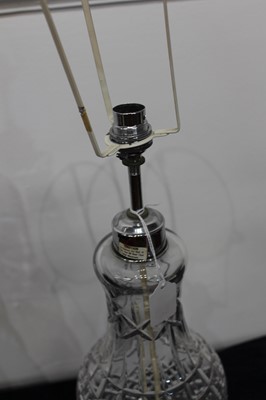 Lot 135 - An early 20th century oil lamp, having clear...