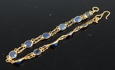 Lot 1184 - A yellow metal sapphire bracelet, having...