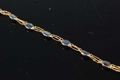 Lot 1184 - A yellow metal sapphire bracelet, having...