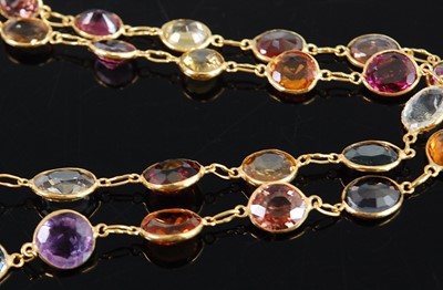 Lot 1182 - A yellow metal multi-stone necklet, comprising...