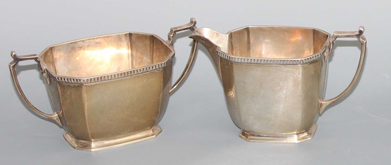 Lot 137 - A late Art Deco silver twin handled sugar bowl...