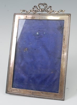 Lot 1150 - An Edwardian silver photograph frame, having...