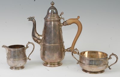 Lot 1151 - A George V silver three-piece coffee set, in...