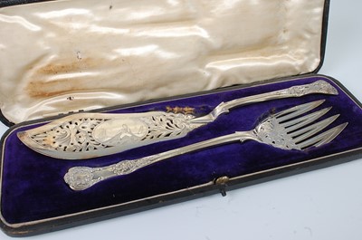 Lot 1156 - A cased pair of Victorian silver fish servers,...