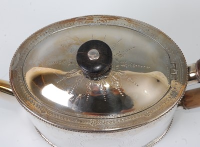 Lot 1160 - A George III silver teapot on stand, of beaded...
