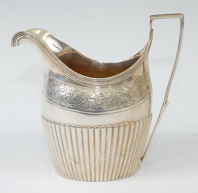 Lot 1162 - A George III silver cream jug, of half-reeded...