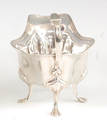 Lot 1164 - An Edwardian silver cream jug, of shaped oval...