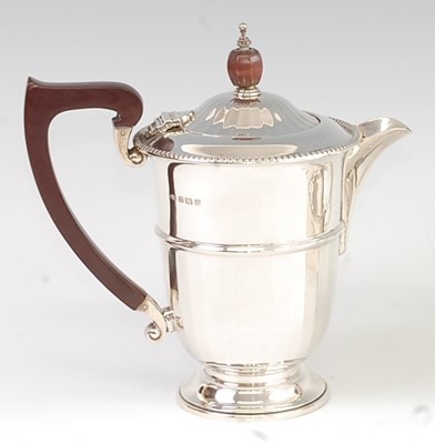 Lot 1163 - A George V silver hot water pot, of ribbed and...