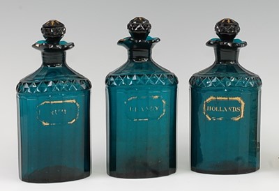Lot 1092 - A set of three early 19th century green glass...