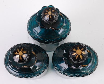Lot 1092 - A set of three early 19th century green glass...