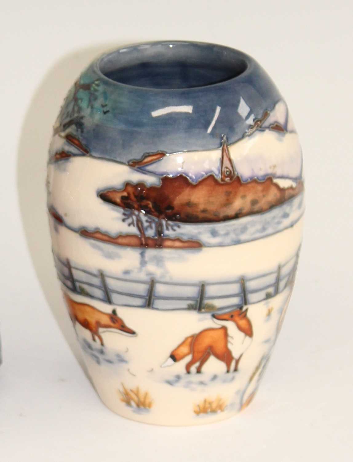 Lot 17 - A contemporary Moorcroft Fox in Snow pattern...