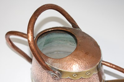 Lot 170 - An Arts & Crafts planished copper and brass...